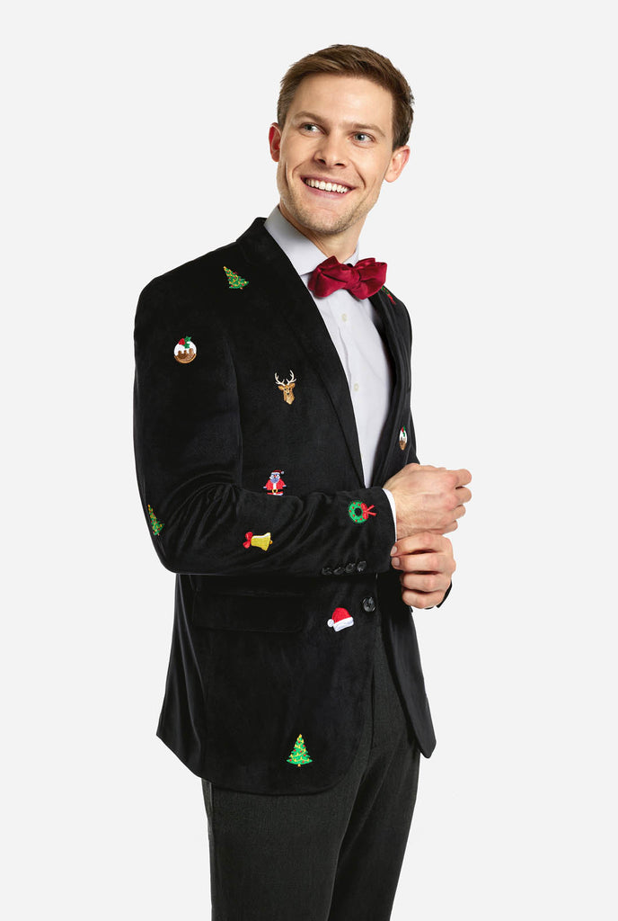 Man wearing black Christmas blazer with Christmas icons