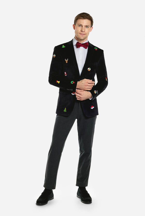 Man wearing black Christmas blazer with Christmas icons