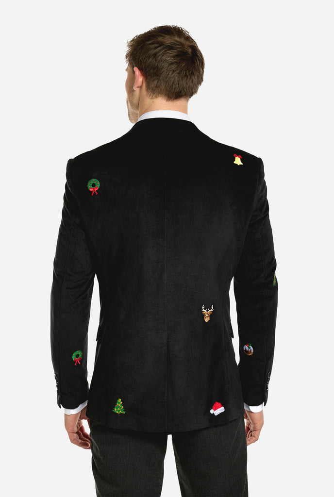 Man wearing black Christmas blazer with Christmas icons, view from the back