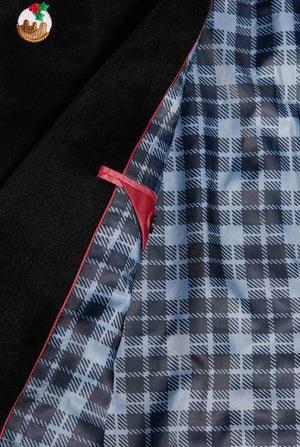 Man wearing black Christmas blazer with Christmas icons, close up inside