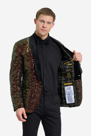 This image showcases a stylish men’s dinner jacket from OppoSuits Deluxe collection, featuring dazzling amber sequins that create a shimmering effect. The sequin blazer has a sleek satin lapel, a tailored fit. The model pairs it with a classic black dress shirt and bow tie, making this jacket perfect for formal events, holiday parties, or New Year celebrations. Ideal for men who want to stand out with bold, luxurious, and festive attire. 