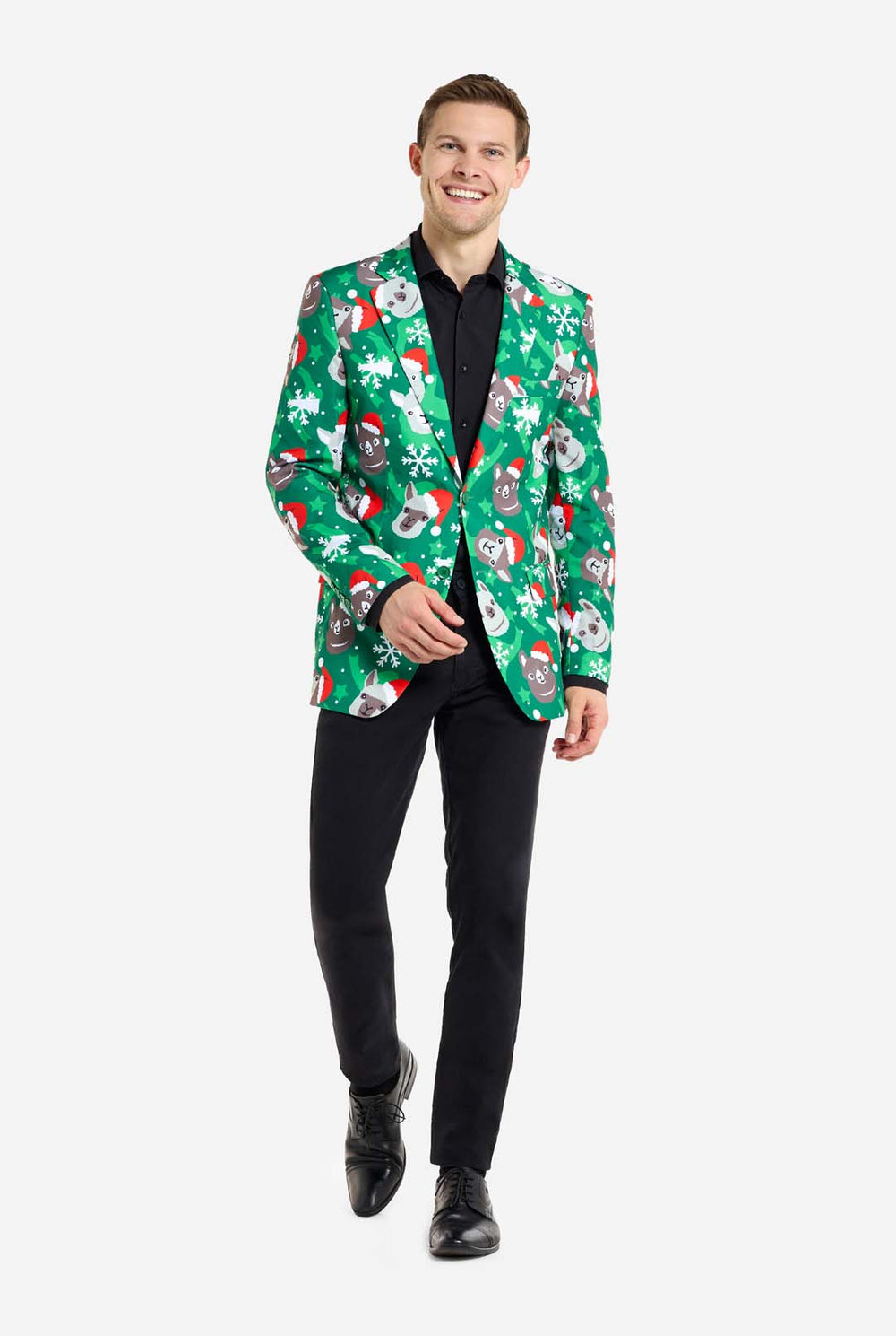 Man wearing green Christmas blazer for men with Christmas llamas. Man also wearing a black pants and black men's shirt.
