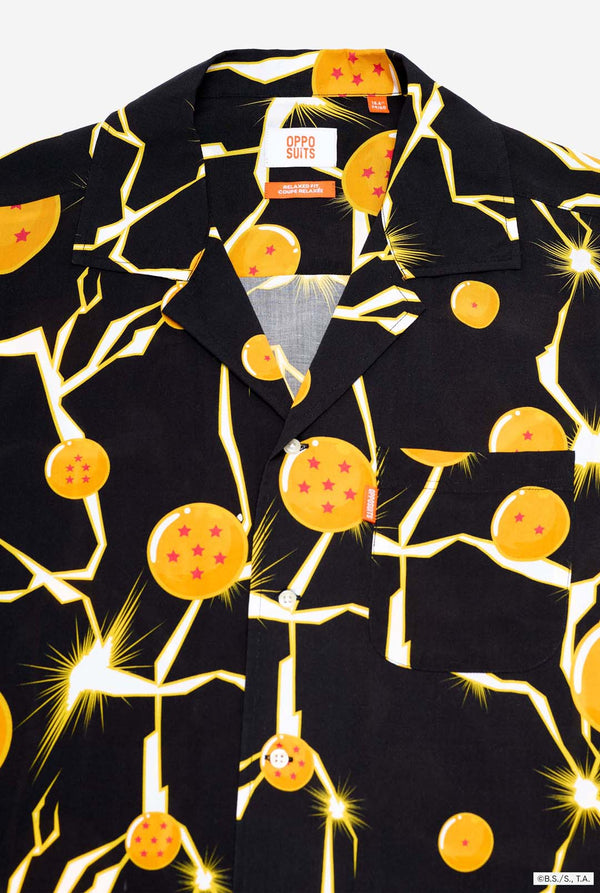 Image of black Hawaiian shirt with Dragon Ball Z print, showings Dragon Balls and lighting. Chest close up.