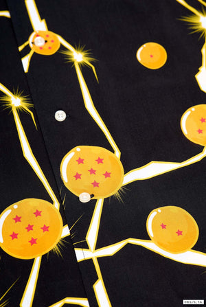 Image of black Hawaiian shirt with Dragon Ball Z print, showings Dragon Balls and lighting. Close up button closure.