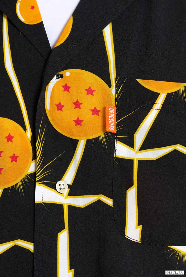 Image of black Hawaiian shirt with Dragon Ball Z print, showings Dragon Balls and lighting. Close up chest pocket.