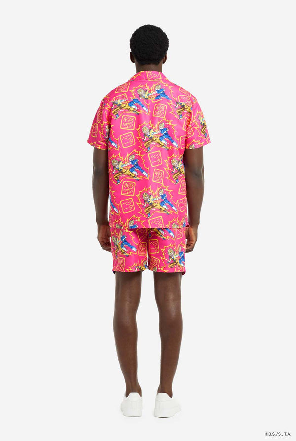 Man wearing pink summer set consisting of shirts and shorts. Summer set has Dragon Ball Z Goku and Vegeta fighting print. View from the back.