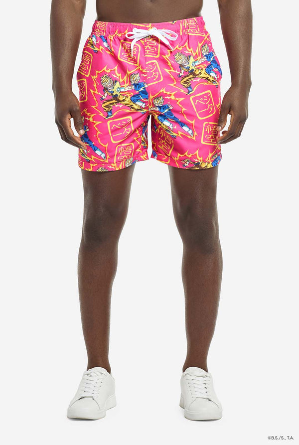Man wearing pink summer set consisting of shirts and shorts. Summer set has Dragon Ball Z Goku and Vegeta fighting print. Shorts close up.