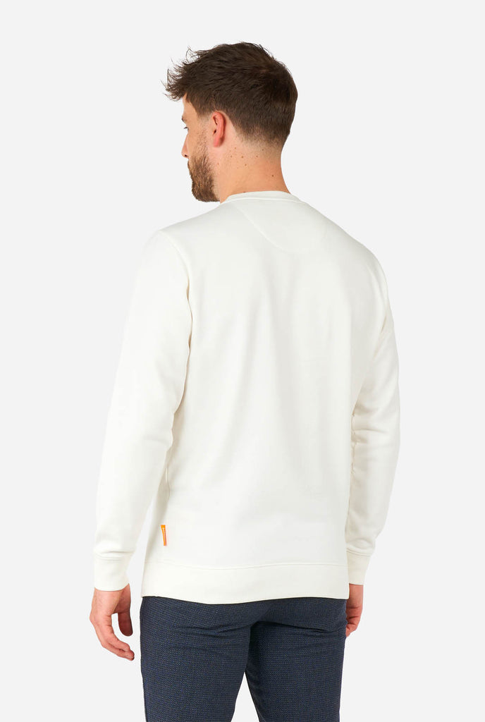 Man wearing white sweater with Elf Christmas image, view from the back