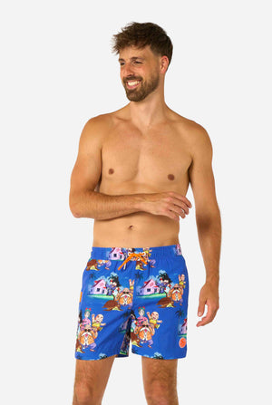Men's blue Dragon Ball-themed swim shorts featuring Goku, Krillin, Master Roshi, and other characters at Kame House. Perfect for anime fans at the beach or pool. 