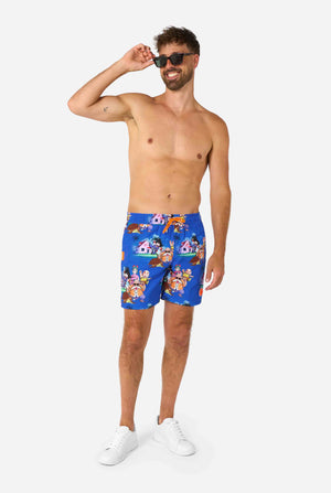 Men's blue Dragon Ball-themed swim shorts featuring Goku, Krillin, Master Roshi, and other characters at Kame House. Perfect for anime fans at the beach or pool. 