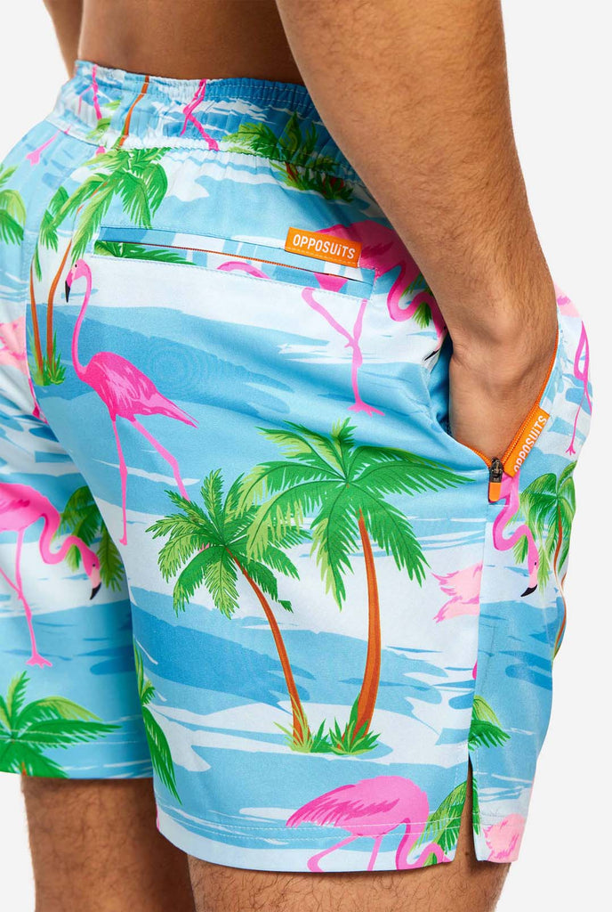 Man wearing Flaminguy swim trunks for men, close up