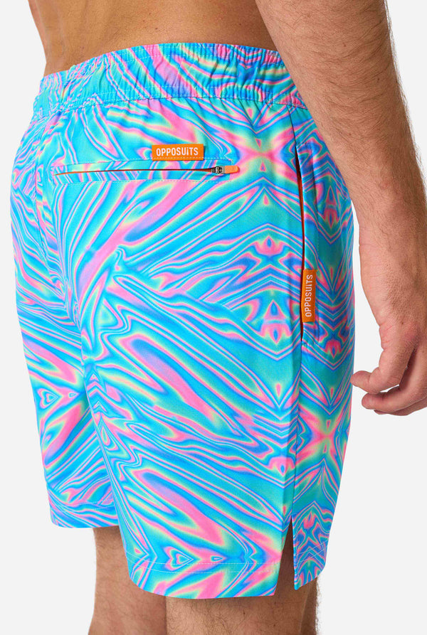 Man wearing a men's vibrant holographic swim shorts with a mesmerizing blue, pink, and purple swirl design. Eye-catching and stylish swimwear for summer fun.