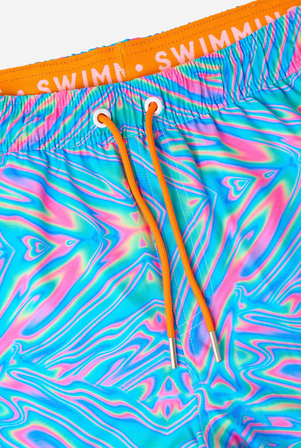 Colorful swim shorts with a tie-dye pattern and orange drawstrings on a white background.