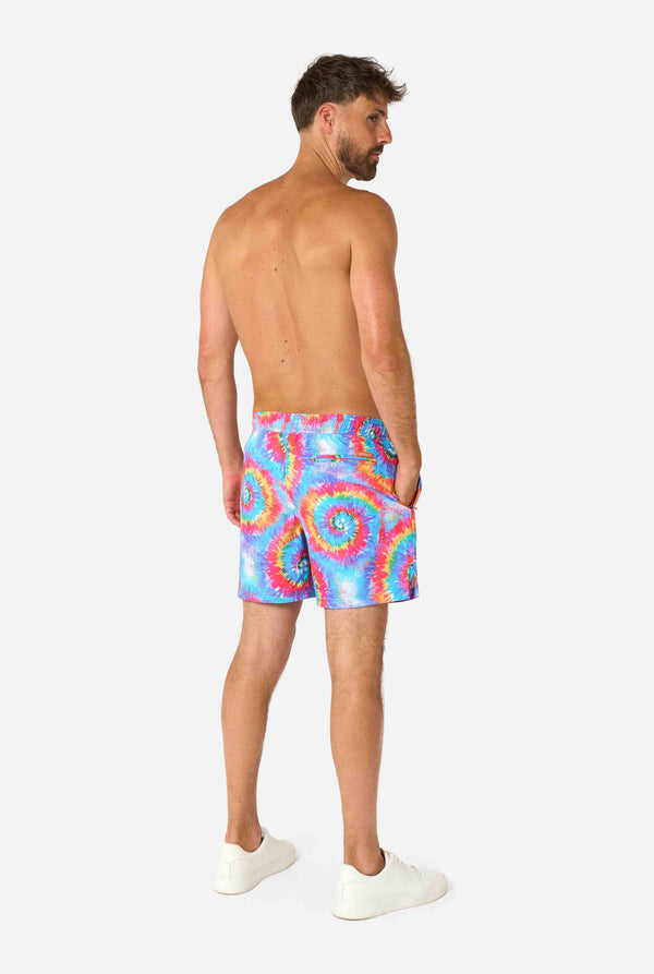 Men's rainbow tie-dye swim shorts with a bold, colorful spiral pattern. A fun and trendy choice for beach days and pool parties.