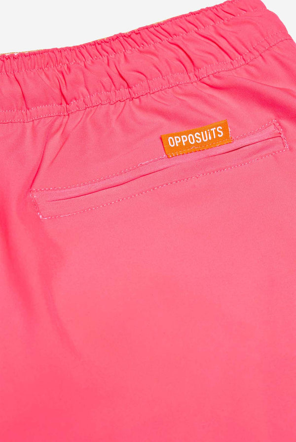 Man wearing Neon Pink Power swim trunks for men, close up