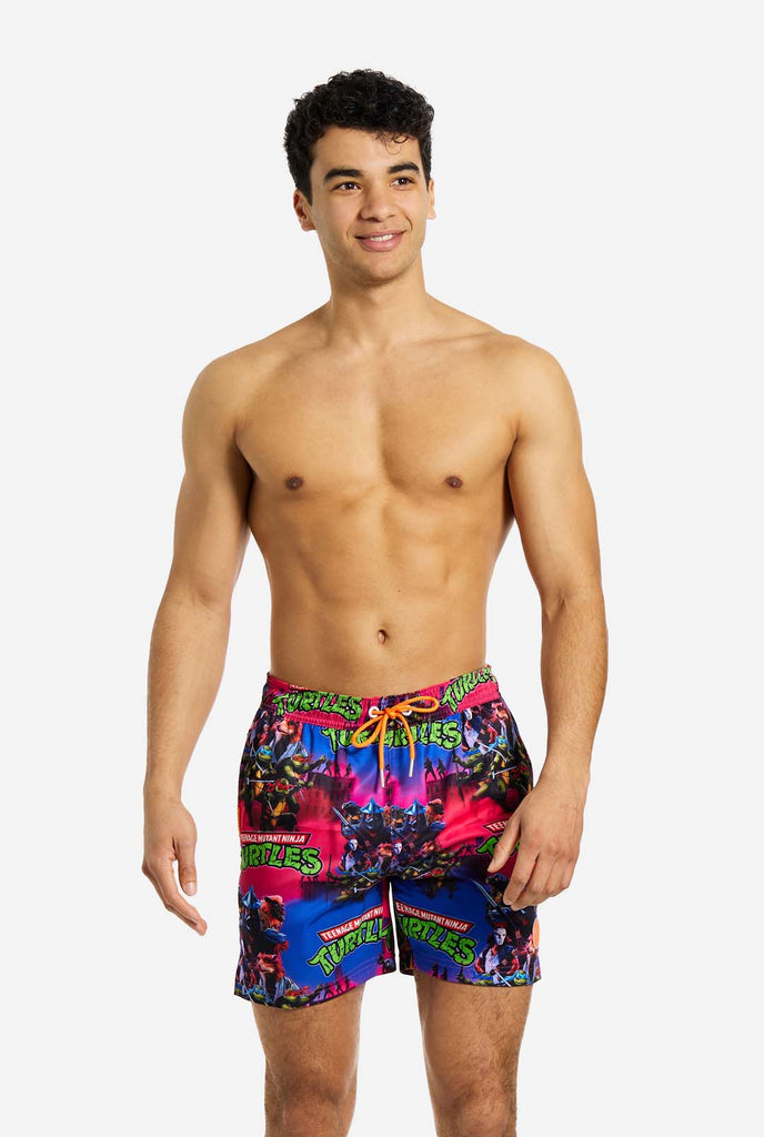 Man wearing TMNT Dude swim trunks for men