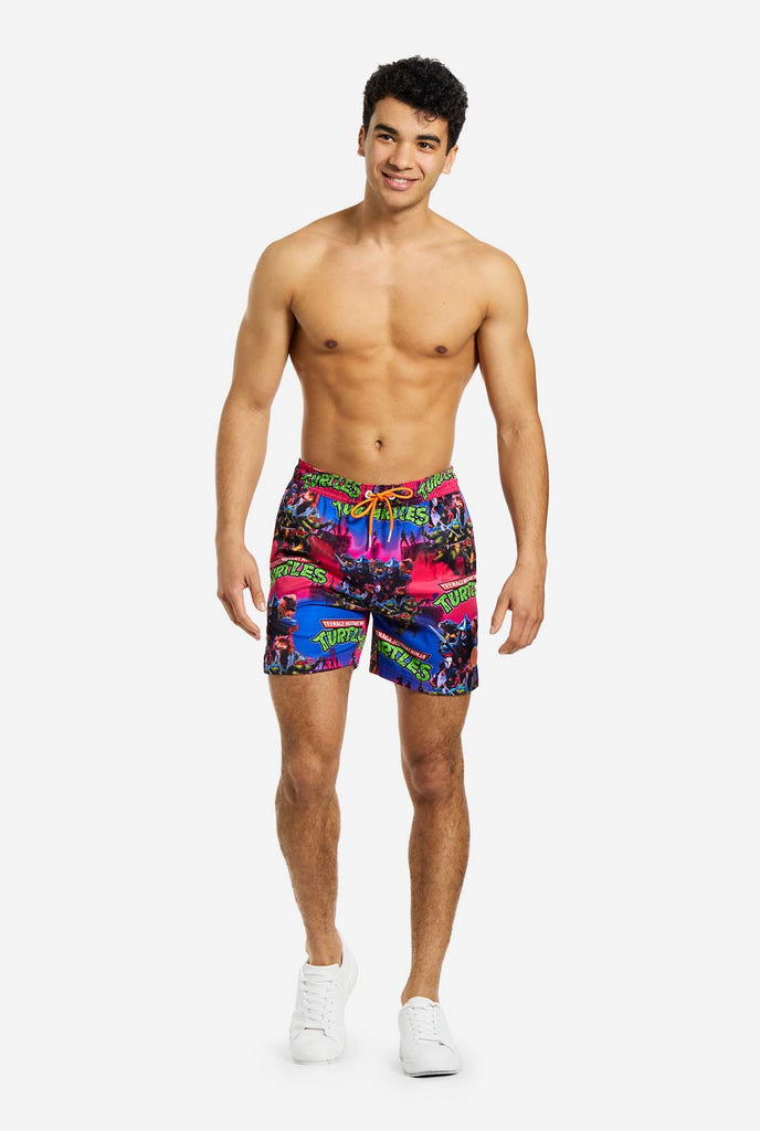 Man wearing TMNT Dude swim trunks for men