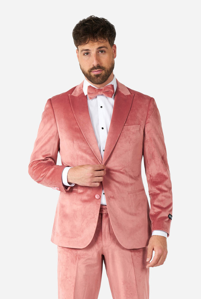 Man wearing pink velvet tuxedo
