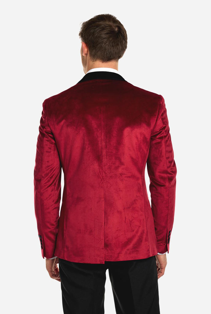 Man wearing burgundy red dinner jacket blazer, view from the back