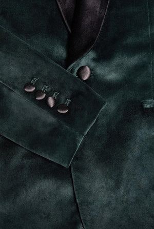 Man wearing dark green dinner jacket blazer, close up