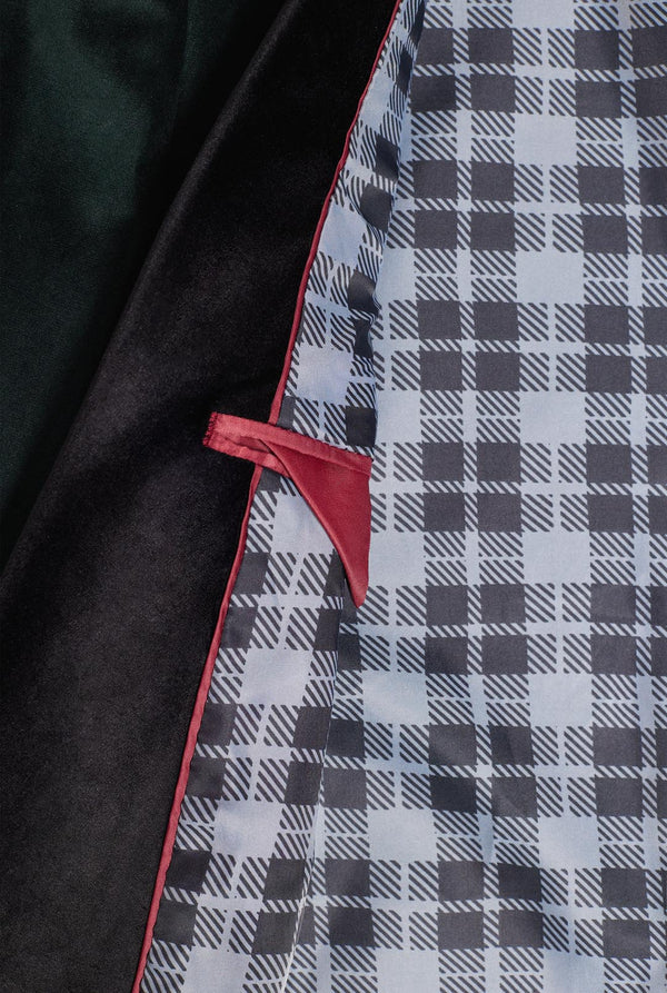 Man wearing dark green dinner jacket blazer, close up inside