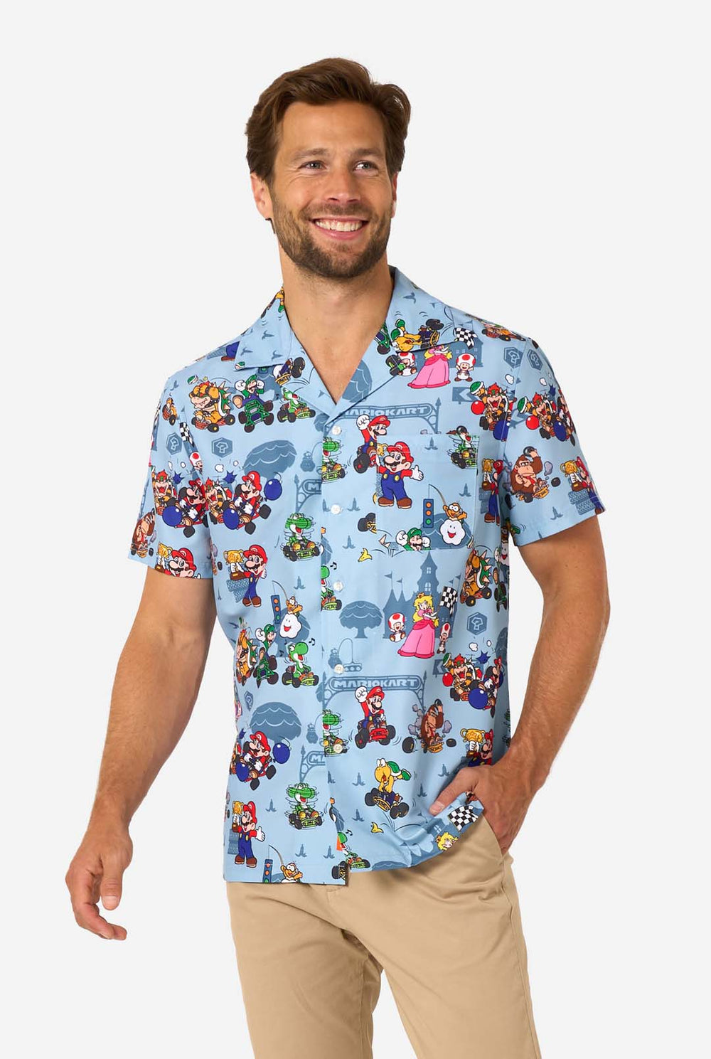 Man wearing light blue short-sleeve Mario Kart shirt with colorful character print.