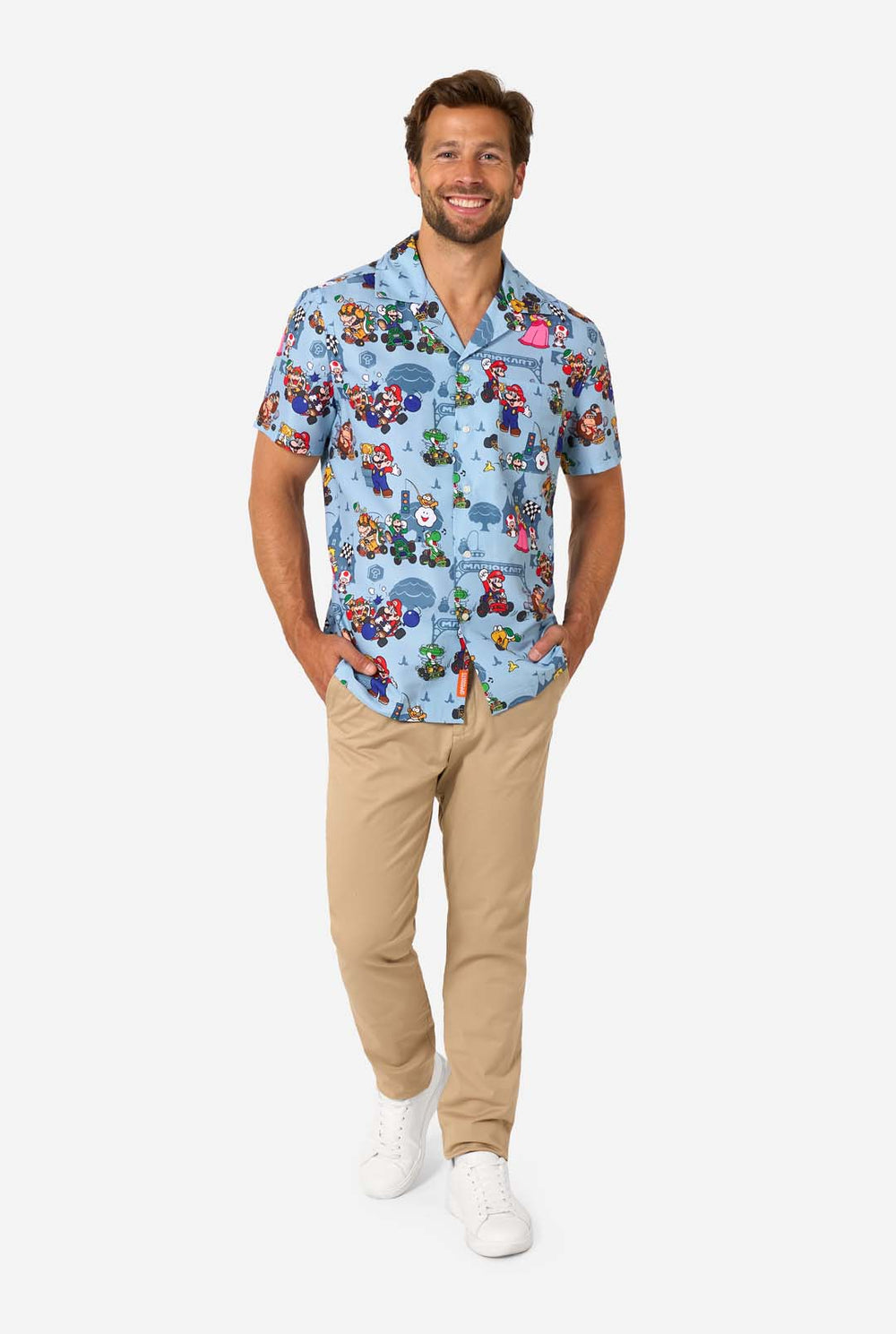 Man wearing light blue short-sleeve Mario Kart shirt with colorful character print.