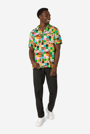 Man wearing a colorful Minecraft Hawaiian shirt featuring pixelated blocks, characters, and items from the game, paired with black pants, standing against a plain white background. Full body image