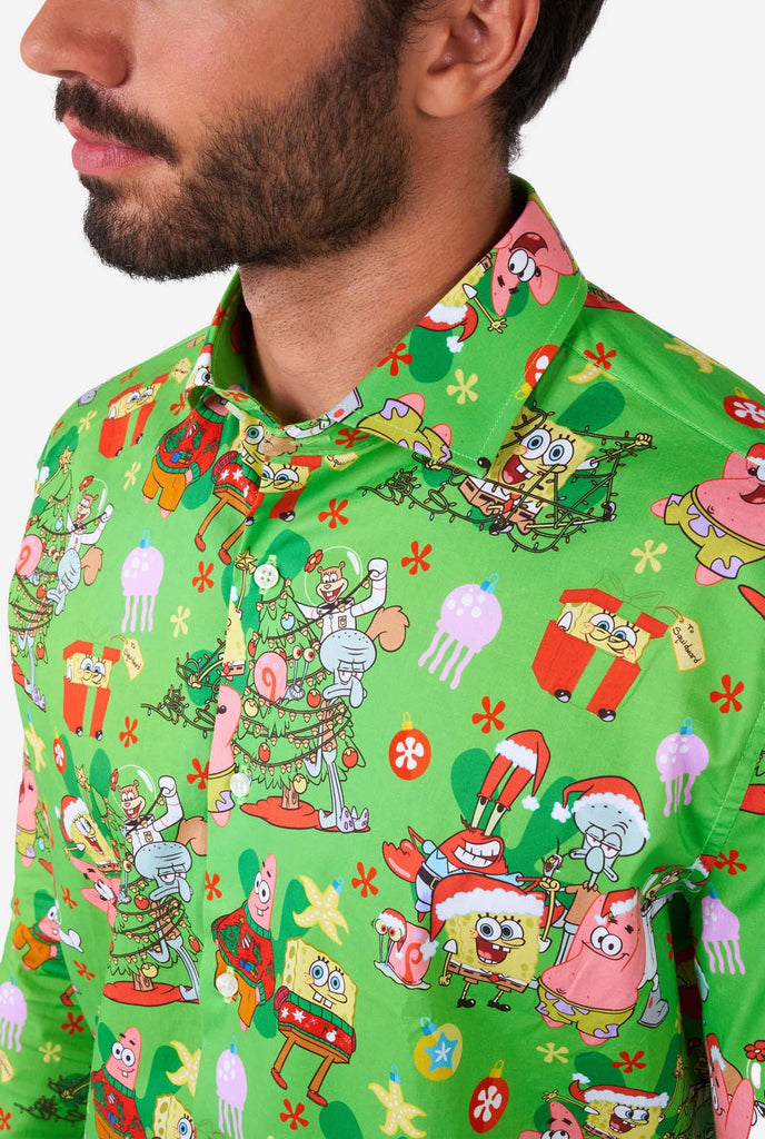 Man wearing green Christmas themed Men's Shirt Spongebob shirt, close up
