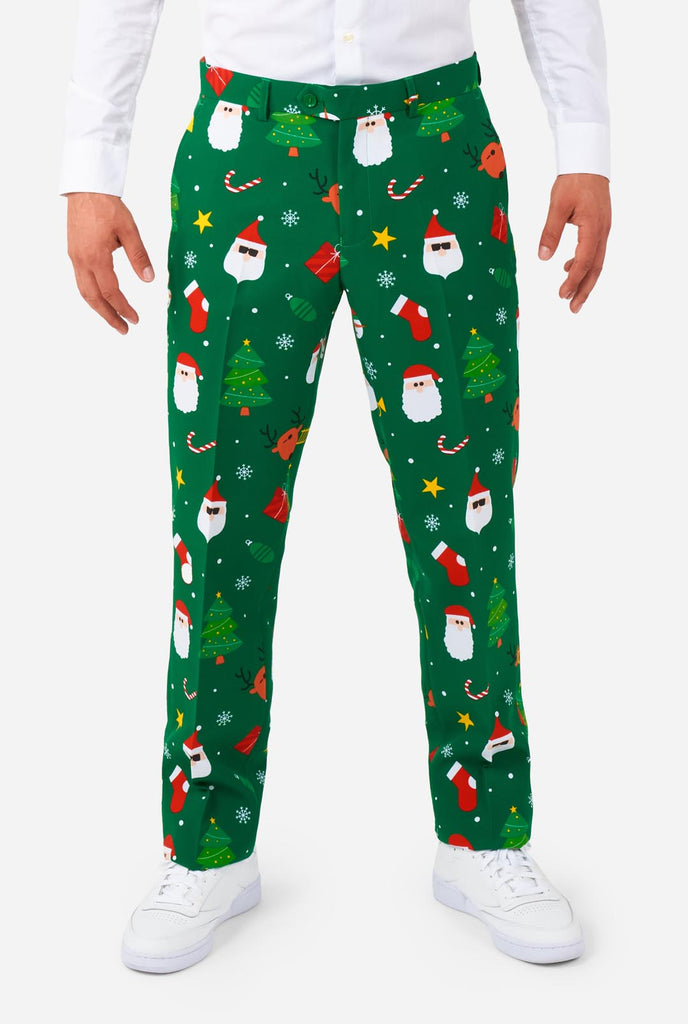 Man wearing green Christmas suits for men with Christmas icons, pants view