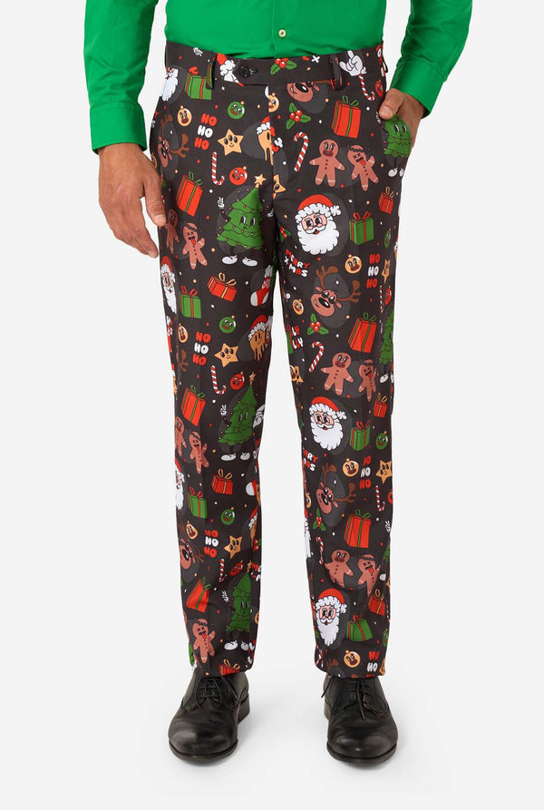 Person wearing festive Christmas-themed pants on a white background