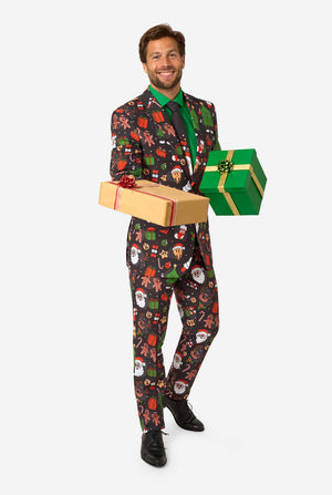 Man wearing a festive suit holding Christmas presents on a white background