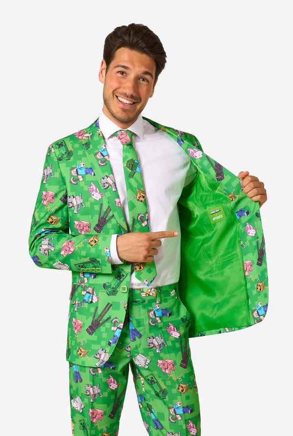 Man showing the inside lining of a green Minecraft suit with official Minecraft and OppoSuits branding.