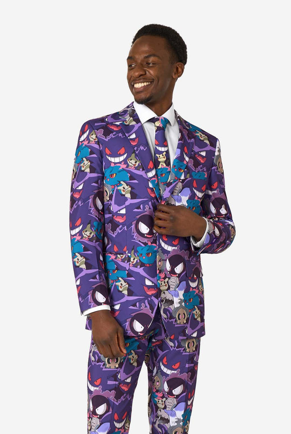 A man wearing a Ghost Pokemon themed suit with a Ghost Pokemon themed tie and a white shirt on a white background.