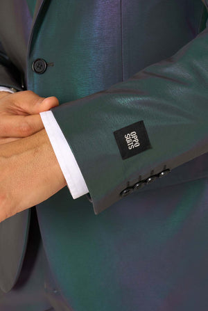 A man wearing a reflective suit, with a reflective tie and a white shirt on a white background. Close up of the sleeves