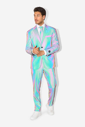 A man wearing a reflective suit, with a reflective tie and a white shirt on a white background. Photo taking with flash on, full body image