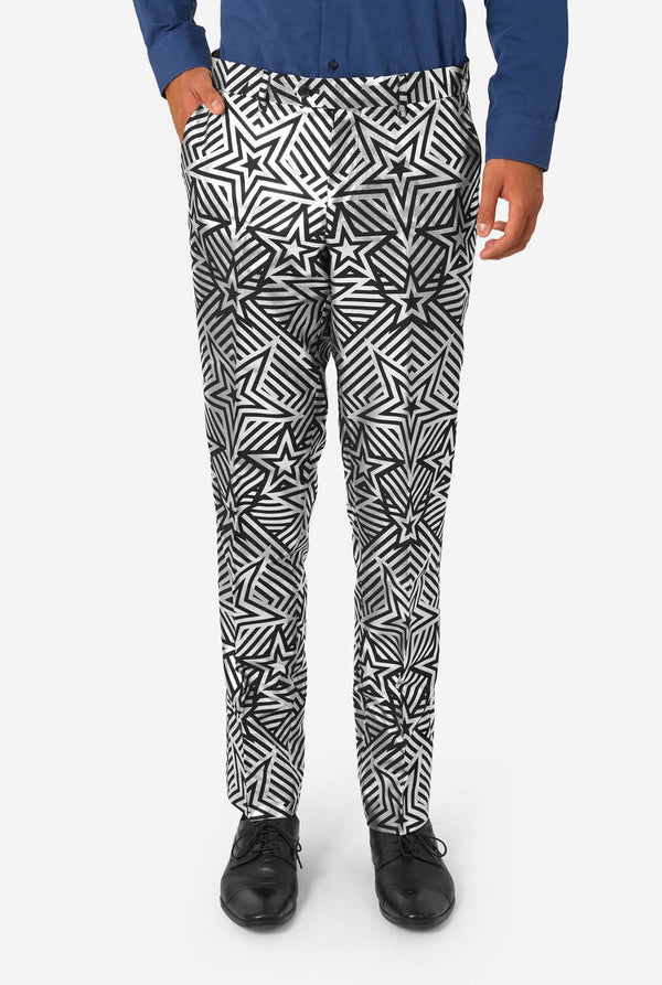 Close-up of matching star-patterned trousers with man’s hands in pockets, showing detail of fit and pattern