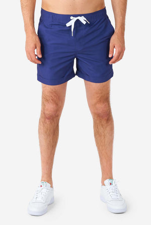 Man wearing blue summer set consisting of shirt and shorts, close-up of the shorts