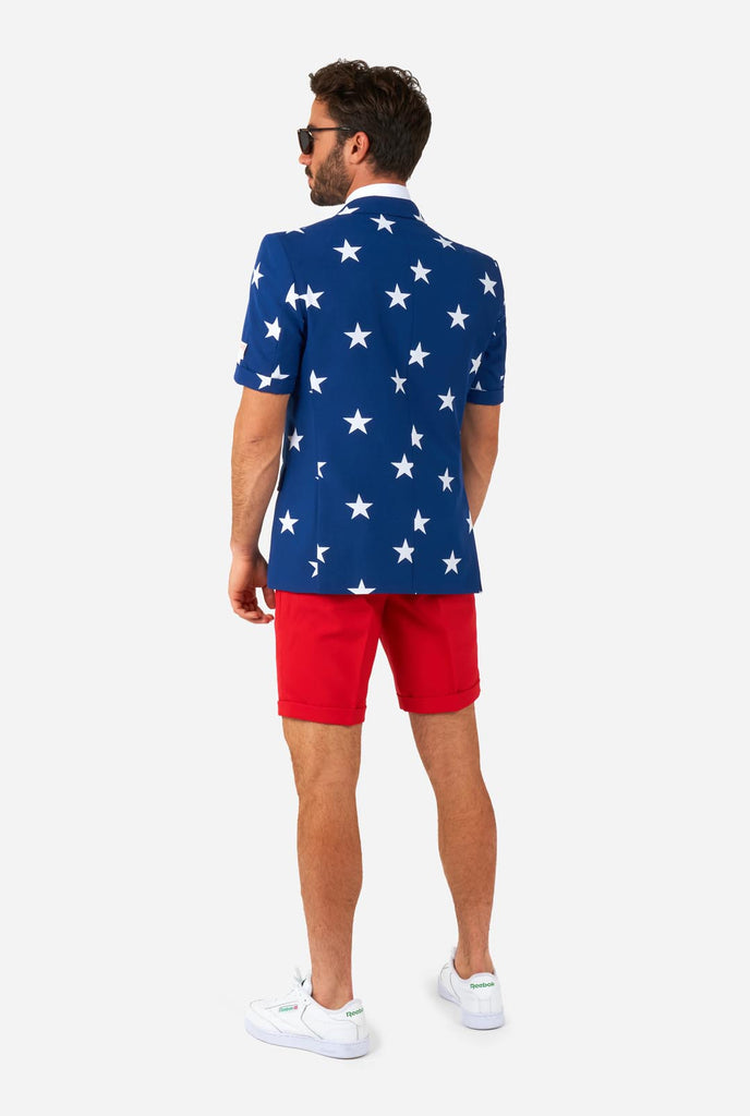 Man wearing American flag themed Summer suit, view from the back