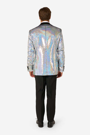 Back view of man wearing a holographic silver sequin tuxedo with black trousers and black dress shoes.
