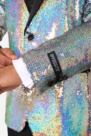 Close-up of holographic silver sequin tuxedo sleeve with black buttons, showing a black OppoSuits brand label above the cuff.