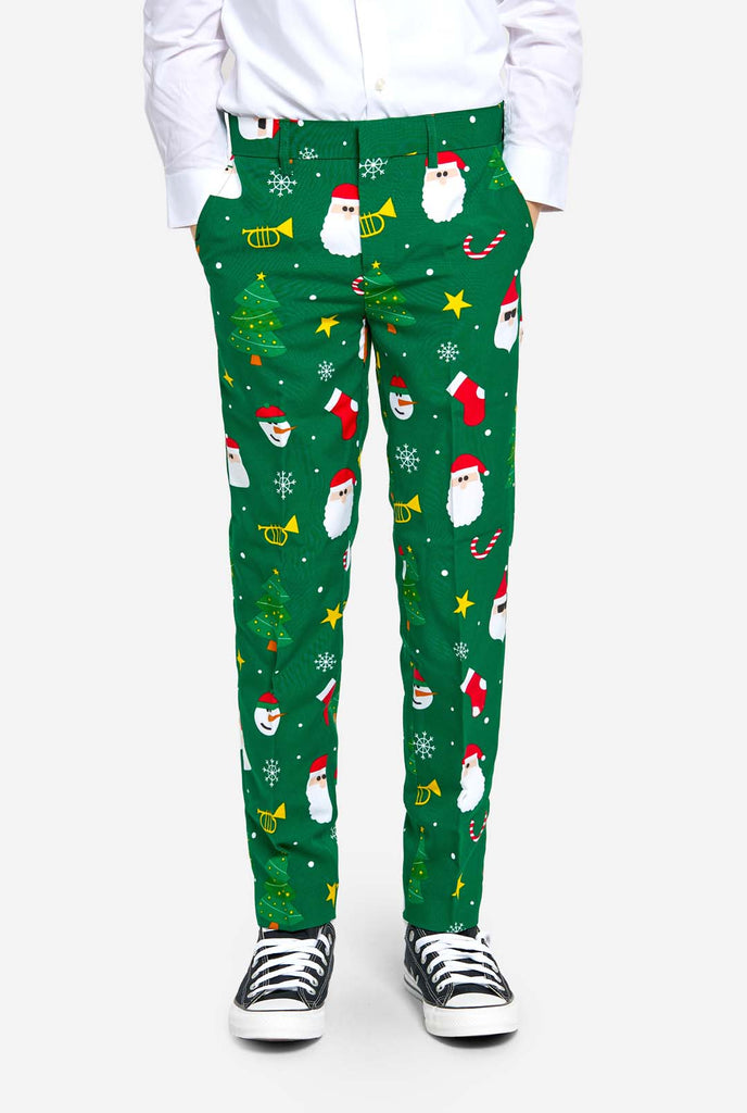 Teen wearing green Christmas suit for teens, with Christmas icons, pants view.