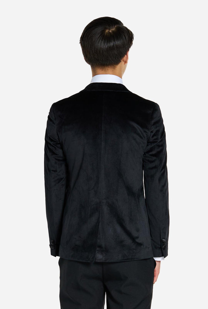 Teen wearing black velvet dinner jacket blazer for teen boys, view from the back