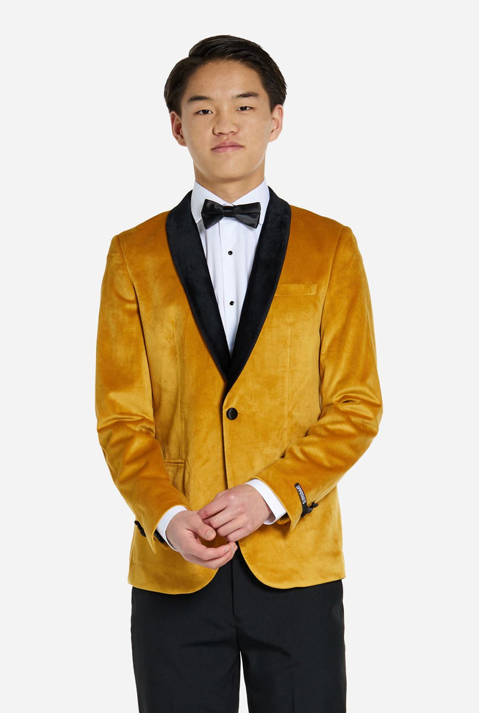 Teen wearing golden velvet dinner jacket