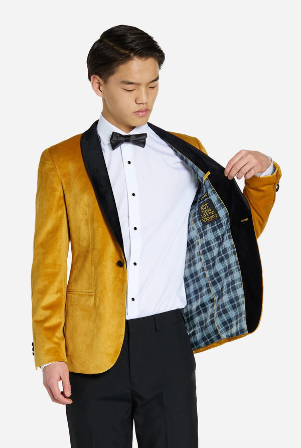 Teen wearing golden velvet dinner jacket