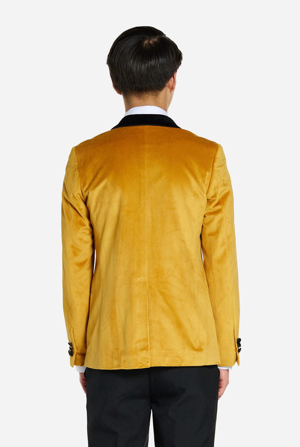 Teen wearing golden velvet dinner jacket
