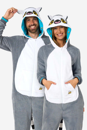 A man and women are wearing a grey and white lemur adult onesie featuring playful hood details and cozy, soft material, perfect for lounging or costume events. Including black and white tail. The hood are on their heads.