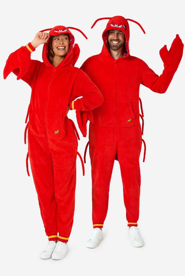 A man and women are wearing a bright red lobster-themed adult onesie featuring playful hood details and cozy, soft material, perfect for lounging or costume events. including stitched gloves as claws. Both are wearing their hood on their heads. Full body image.
