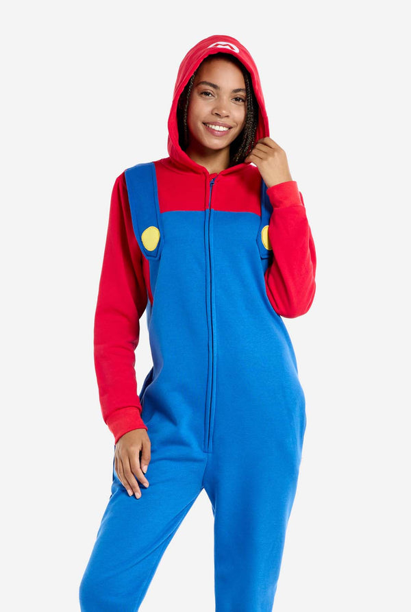 Woman wearing unisex adult onesie with Super Mario print