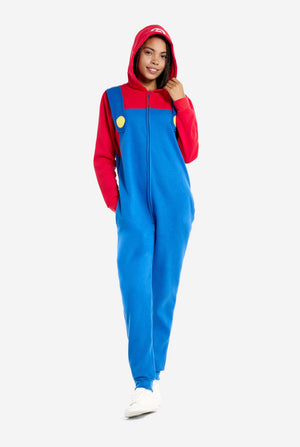 Woman wearing unisex adult onesie with Super Mario print